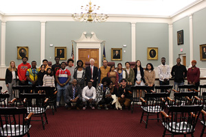 Chief Justice MacDonald with a group from Overcomers Refugee Services in the NH Supreme Court